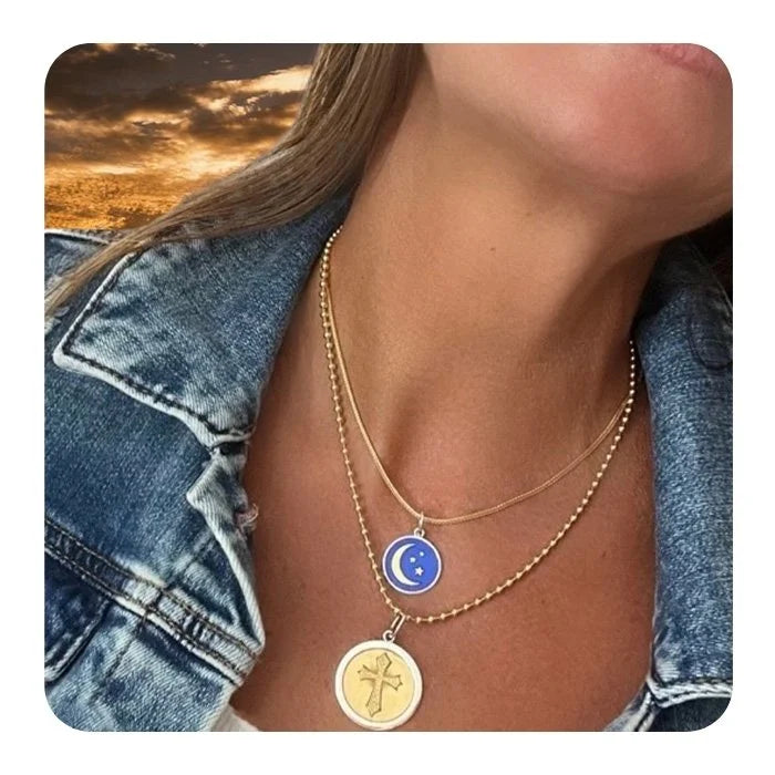 Necklace with celestial pendant worn by a person against a sunset background - 2
