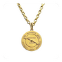 Gold necklace with a round pendant on a white background